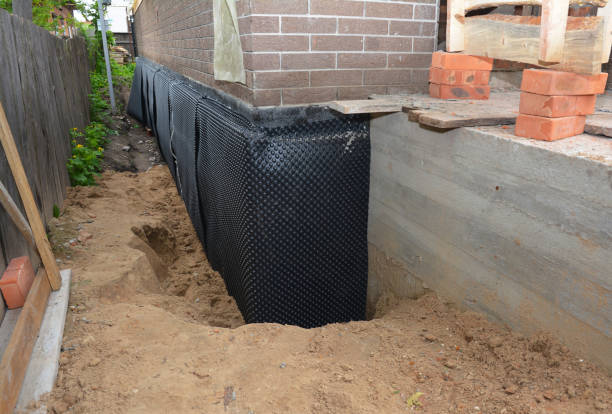 Happy homeowners after waterproofing job in Elmwood Park